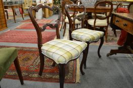 A pair of Victorian rosewood dining chairs.