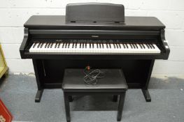 A Technics electronic piano with stool.