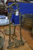 An ornate brass easel.