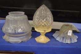 Two glass shades and a light fitting with pineapple shaped glass shade.