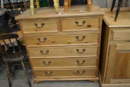 A pine chest of drawers.