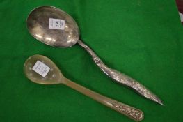 A Continental white metal ladle and a horn spoon.