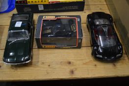 Three large model cars, one boxed.