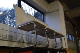 A set of four cantilever style seats.