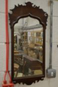 A mahogany fretwork framed wall mirror.