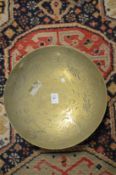 A Chinese engraved brass bowl.