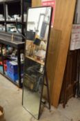A metal framed cheval mirror.