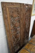 An Eastern carved and pierced wood folding dressing screen.