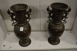 A pair of Japanese bronze vases.
