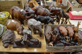 A large collection of carved hardwood animals to include elephants, hippos etc.