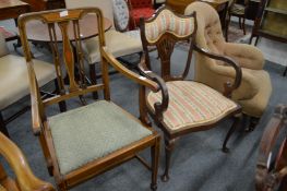 Two Edwardian mahogany open armchairs.