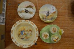 A pair of Doulton saucers painted with game birds, a novelty cruet and a Bunnykins dish.