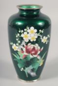 A JAPANESE GREEN GROUND CLOISONNE VASE, decorated with flowers, 18cm high.