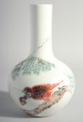A CHINESE POLYCHROME VASE with a bird and a pink tree. 10ins high.