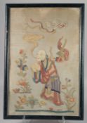 A CHINESE SILKWORK PICTURE of a man holding a peach. 25ins x 17ins.