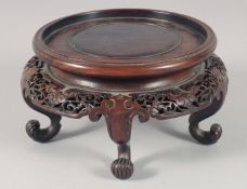 A FINE CHINESE HARDWOOD STAND, raised on five curving legs, to fit a base of 14cm diameter.