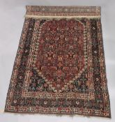 A GOOD PERSIAN CARPET, red ground with all over stylised floral decoration, attached label; Barin