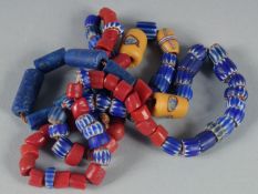 A STRING OF MIXED BEADS.