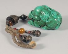 A CHINESE TURQUOISE FIGURE OF AN ELEPHANT, on a beaded chain.