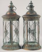 A PAIR OF ORNATE CIRCULAR METAL LANTERNS. 21ins high.