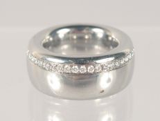 A TITANUS DESIGNER DIAMOND SET RING.