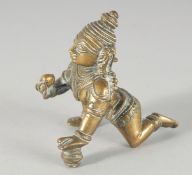 A 19TH CENTURY INDIAN BRASS FIGURE OF CRAWLING KRISHNA, 8cm high.