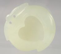 A SMALL CHINESE CARVED JADE HEART SHAPED BRUSH WASHER. 5cm diameter.