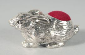 A CAST SILVER RABBIT PIN CUSHION. 4cm