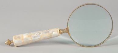 A MAGNIFYING GLASS with mother of pearl handle.