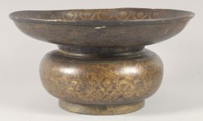 A FINE INDIAN BRONZE BASIN, with foliate decoration, 34cm diameter.