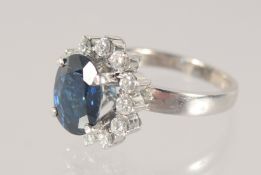 A GOOD 18CT WHITE GOLD SAPPHIRE AND DIAMOND RING.
