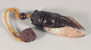 A JAPANESE CARVED WOOD AND MOTHER OF PEARL INRO, modelled as a bug. 11cm long.