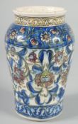 A PERSIAN QAJAR GLAZED POTTERY VASE, painted with foliate motifs, 19cm high.