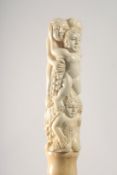 A WALKING STICK WITH CARVED BONE HANDLE as figures and grapes.