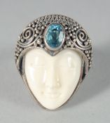 A SILVER AND ENAMEL ART DECO FACE RING.
