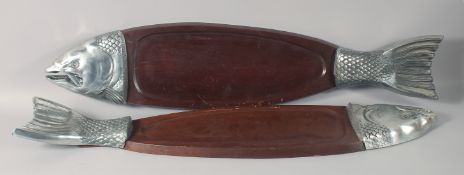 A PAIR OF HARDWOOD AND METAL MOUNTED FISH SHAPED SERVING PLATTERS. 35.5ins long.