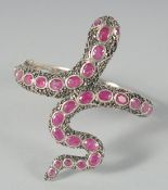 A GOOD SILVER RUBY SET SNAKE BANGLE.