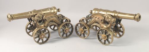 A PAIR OF BRASS CANNONS 18ins long.