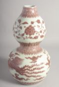 A CHINESE UNDERGLAZE RED AND WHITE DOUBLE GOURD VASE, decorated with phoenix, six-character mark,