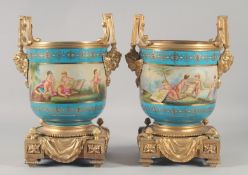 A PAIR OF SEVRES STYLE PORCELAIN AND ORMOLU TWIN HANDLED CACHE POTS. 13ins high.