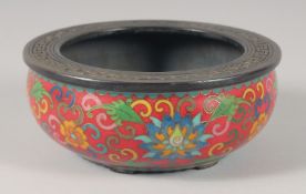 A CHINESE CLOISONNE ENAMELLED BRONZE CENSER, the interior with characters, 15.5cm diameter.