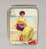 A SMALL MODERN SILVER PILL BOX, with enamel decoration of a girl seated on a bench. 3cm c 2.5cm