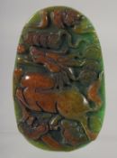 A CHINESE MULTI-COLOURED JADE PENDANT carved with a horse. 9.5cm.