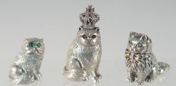 THREE CAST SILVER CATS. 3cm