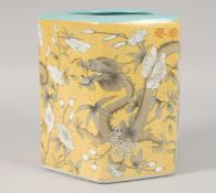A CHINESE HEXAGONAL TURQUOISE AND YELLOW GLAZE PORCELAIN BRUSH POT, decorated with dragons and