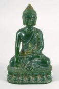 A THAI CARVED GREEN HARDSTONE BUDDHA. 13cm high.