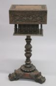 AN ANGLO-INDIAN WORK BOX ON STAND with a hinged top, above turned spindle supports, on a carved