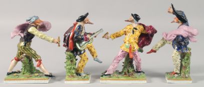 A SET OF FOUR, POSSIBLY SAMSON, PORCELAIN FIGURES. 6.5ins high.