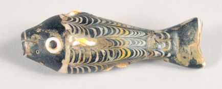 A RARE EARLY ISLAMIC -POSSIBLY MAMLUK MARVERED GLASS FISH, 7cm long.