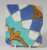 A 15TH CENTURY PERSIAN TIMURID CUERDA SECCA TILE, 13cm x 11.5cm.